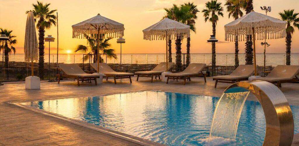 Sunset over the pool and Adriatic Sea at the resort